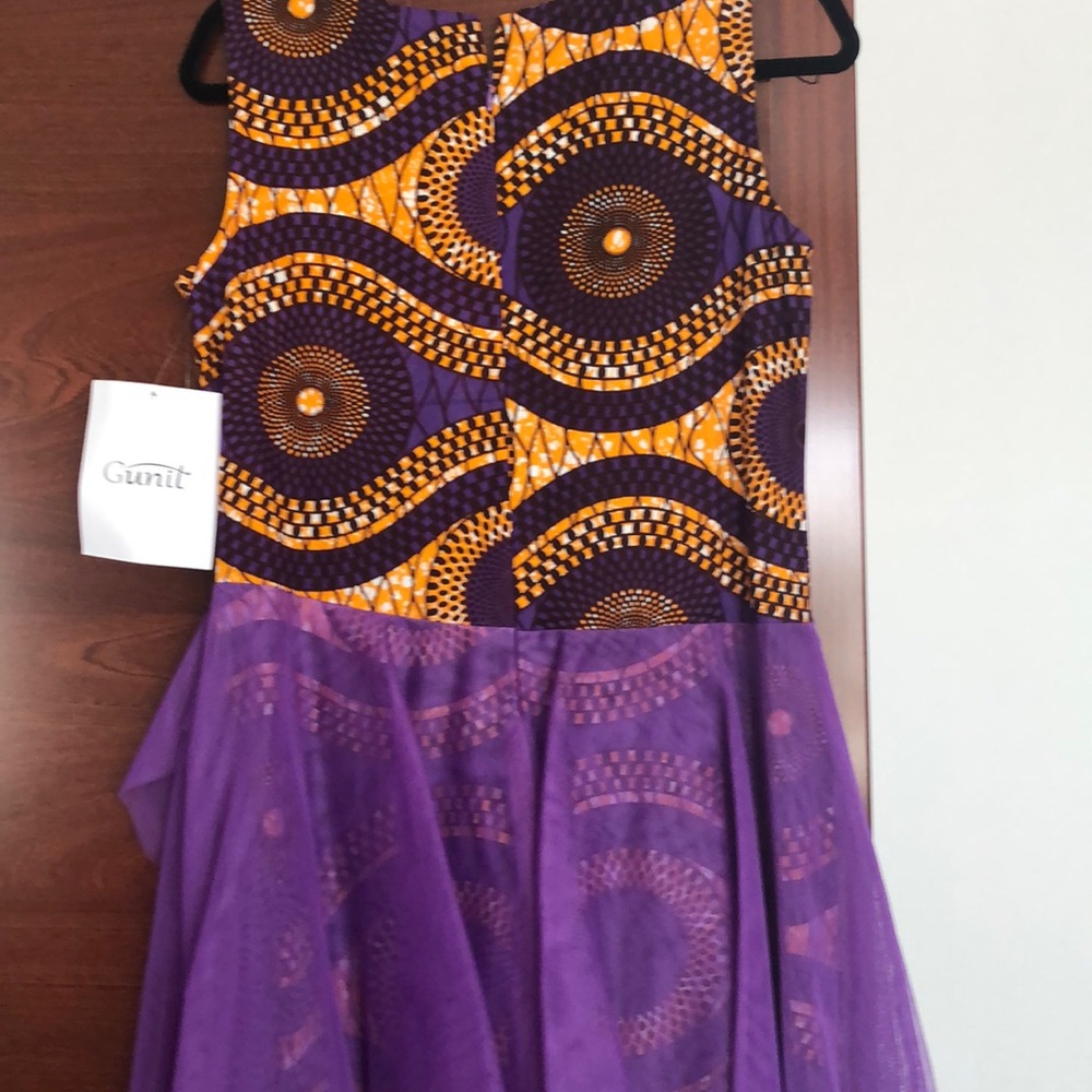 Brand new unique midi dress. Multi color.Size10 Never worm.
